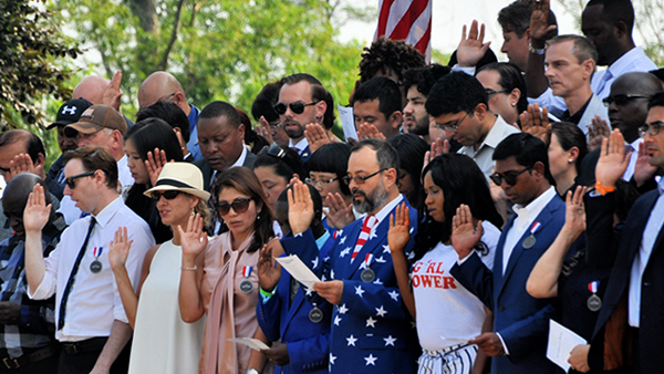 A U.S. Constitution document with a quill, ink bottle, and American flag, symbolizing the founding principles supported by FFROA.