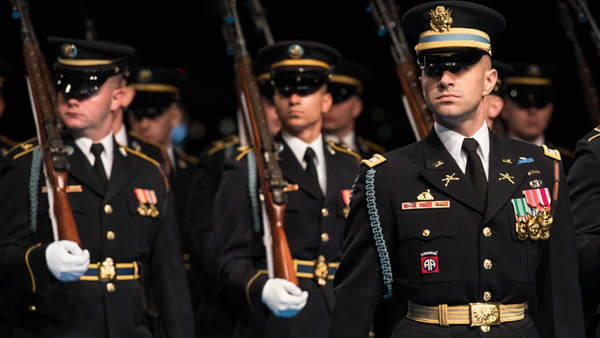 A U.S. Constitution document with a quill, ink bottle, and American flag, symbolizing the founding principles supported by FFROA.